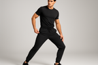 Create a guy model picture wearing black color elastic track pants showing how good is the product